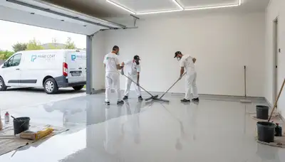 Epoxy floor coating in El Paso TX garage by professional painters for durable, glossy surface finish