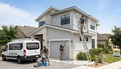 Professional house painters in El Paso TX applying fresh exterior paint to a residential home